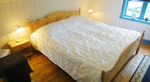 Our lakeside cottage in Sweden has a cosy bedroom.
